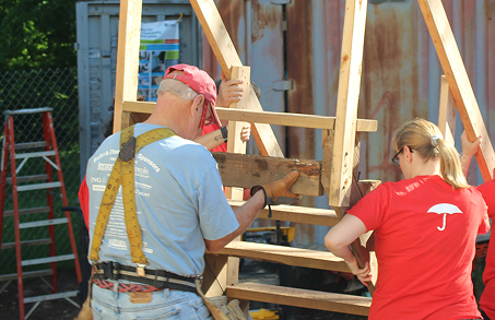 Travelers employees doing carpentry at construction site