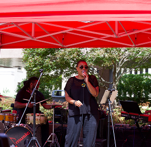 band playing under a tent outdoors