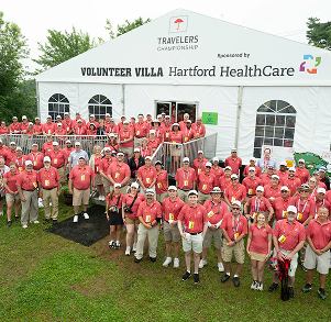 group posing for camera at Travelers Championship